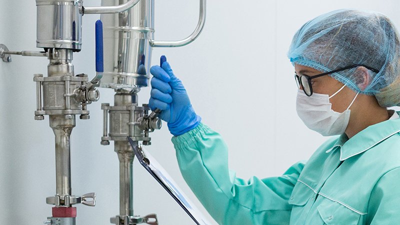 scientist in blue suit checking pressure